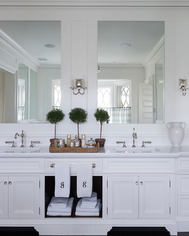 Bathroom Cabinet Design. Master Bathroom Cabinet. This double vanity includes both concealed and display storage spaces. Its mirrors reflect the view at the bay window behind. #Bathroom #MasterBathroom #BathroomCabinet 