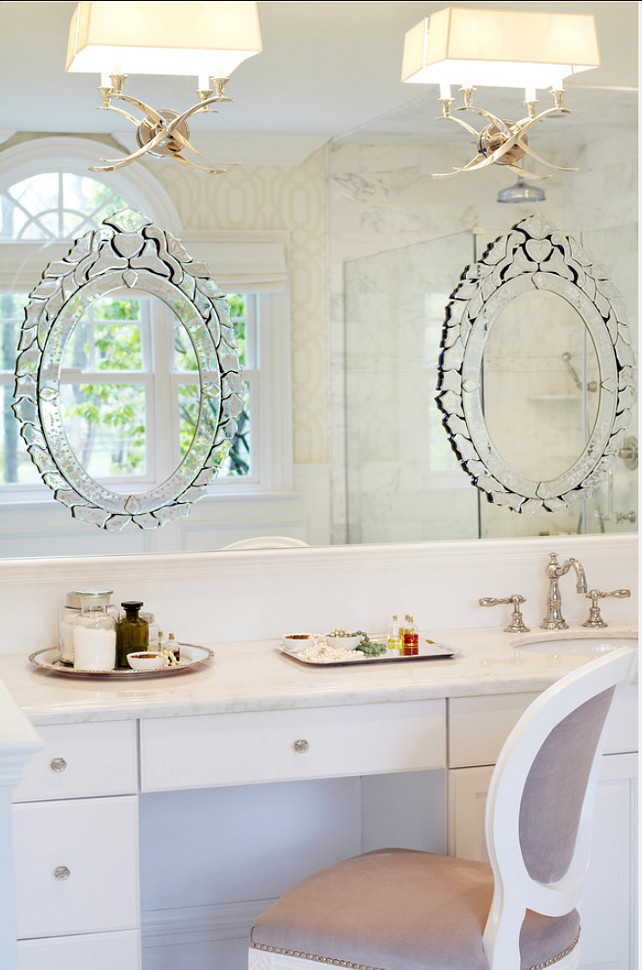 Bathroom Ideas. A custom white and light gray linen chair was used here along with venetian mirrors which were glued over a larger mirror to provide a continuity of reflective effect. #Bathroom #BathroomDesign #BathroomDecor