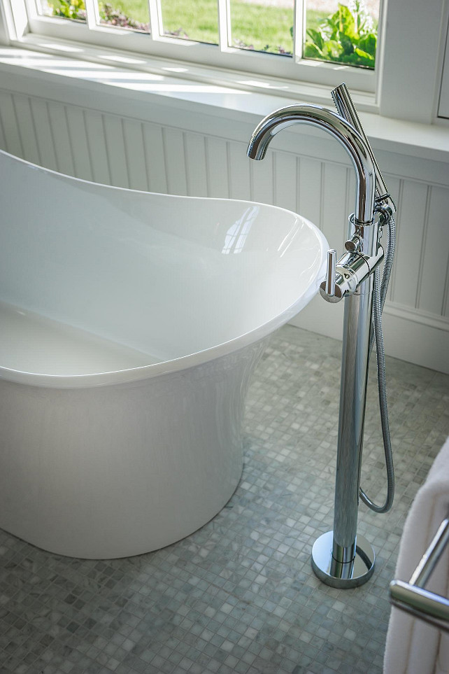 Bathroom Ideas. A free-standing tub sits on eye-catching mosaic Carrera marble flooring. #Bathroom