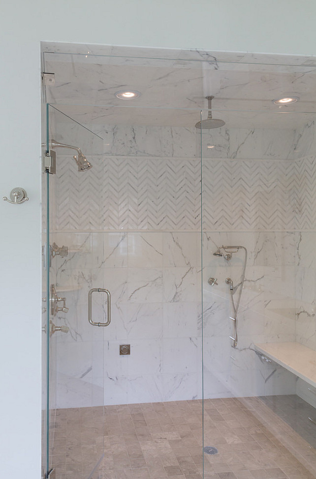 Bathroom Shower. Bathroom with steam shower. Shower tiling. Shower with glass door and marble bench. #Bathroom #Shower Blue Water Home Builders.