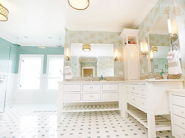 Bathroom with wallpaper and marble floors. Master bathroom