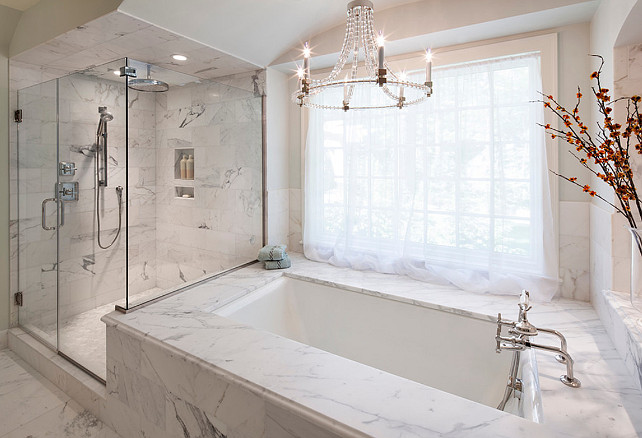 Bathroom. Bathroom Design. The master bathroom features frameless glass shower panels, Calacatta marble, and quality fixtures. #Bathroom 