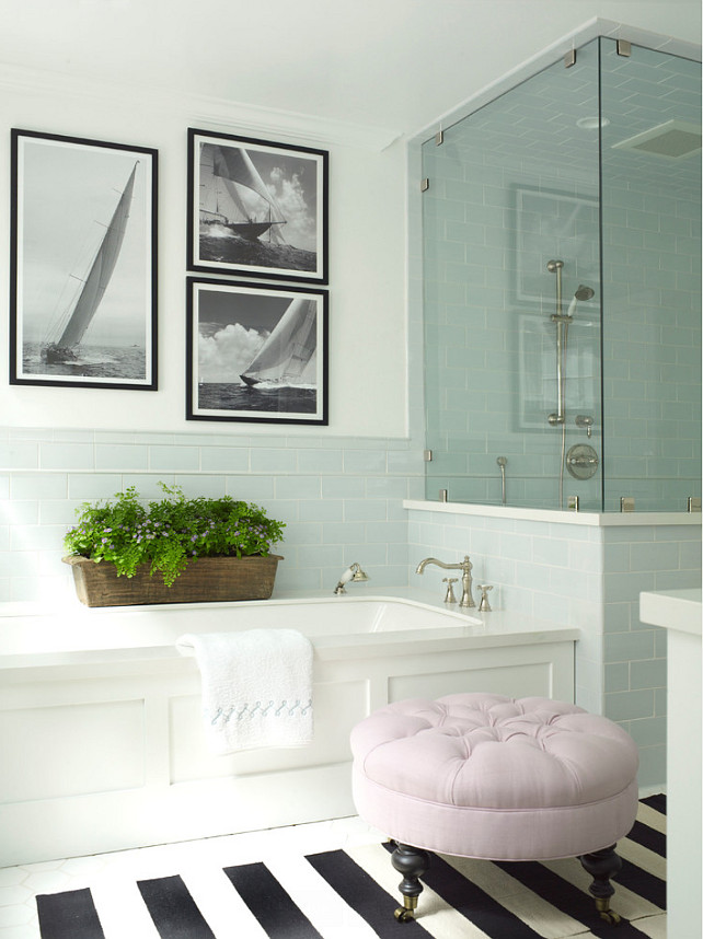 Bathroom. Bathroom ideas. Bathroom with wainscoted bathtub accented with Moen fixtures with blue glass subway tiled backsplash. #Bathroom . Burnham Design.