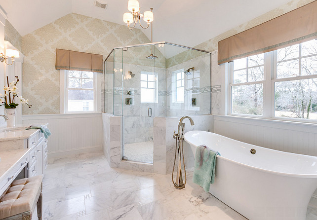 Bathroom. Bathroom with Soaking tub, glass shower, mini-chandelier from the Progress Lighting Fortune collection, marble floors - this master bath embodies spa-like luxury! The freestanding tub filler is the Brizo Virage: Single-Handle Freestanding Tub Filler. #Bathroom