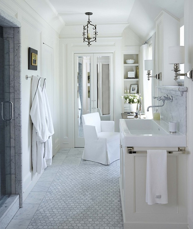 Bathroom. Marble Flooring Bathroom. Stunning bathroom with marble tiled walk-in shower with glass door opposite an ivory sink vanity. #Bathroom #MarbleBathroomFlooring Dungan Nequette Architects.
