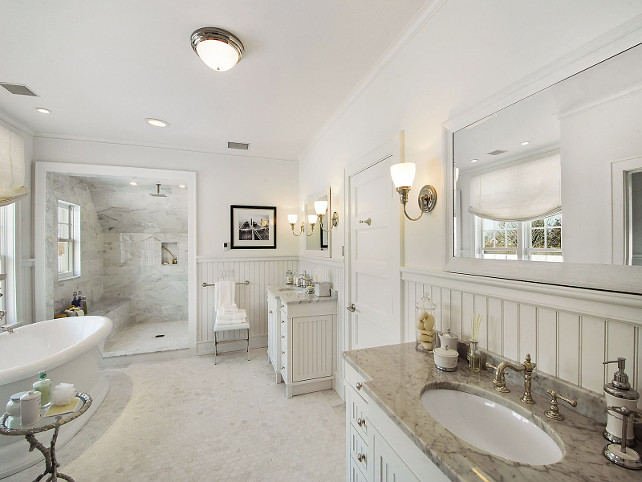 Bathroom. White Bathroom with marble flooring, separate shower and freestanding bathtub. #Bathroom Sotheby's Homes.