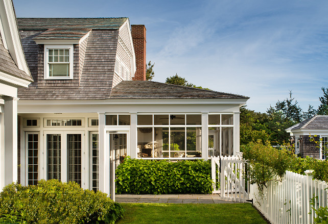 Beach house. Beach Cottage. Cape cod. Cedar shake. Collumns Double gambrel. Gambrel roof. Martha's Vineyard. Massachusettes. New England. Screened porch. Garden. Picket Fence. White Picket Fence. Shake roof. Shakes. Single exterior. Summer house