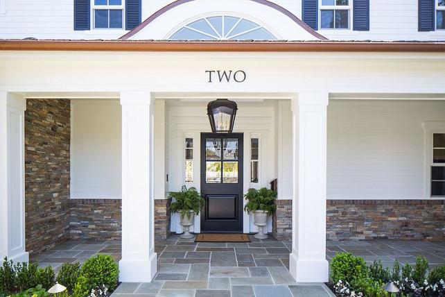 Black Door Front Entry. Black Door Front Entry Ideas. Black Door Front Entry Decor. Front entry with stone flooring porch and black door. #BlackDoor #FrontEntry Kelly Nutt Design.