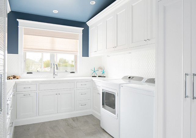 Blue and white laundry room. Laundry room with white cabinets and blue paint on walls and ceiling. #BlueandWhite #LaundryRoom Brandon Architects, Inc.