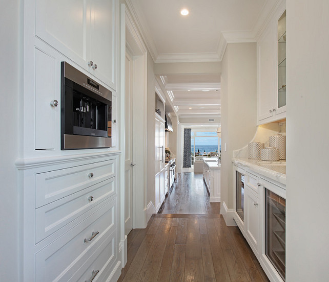 Butler's Pantry. White butler's pantry cabinet with white marble countertop and polished nickel hardware. #ButlersPantry Spinnaker Development.