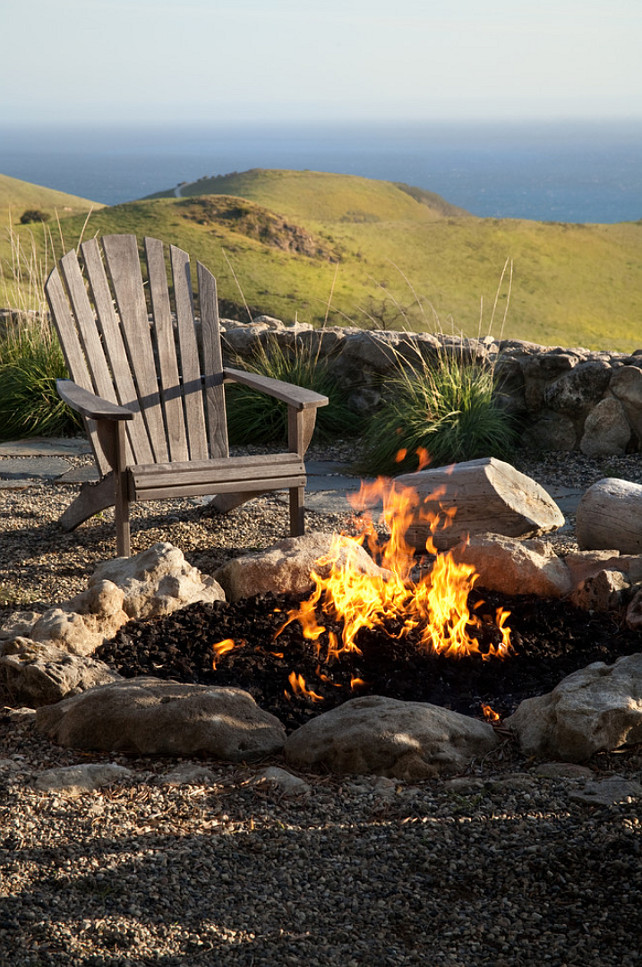 Camp Fire. Backyard camp fire. Naturalist ocean view landscape with camp fire and Adirondack chair makes for a great outdoor living space. #Backyard #CampFire Margie Grace - Grace Design Associates.