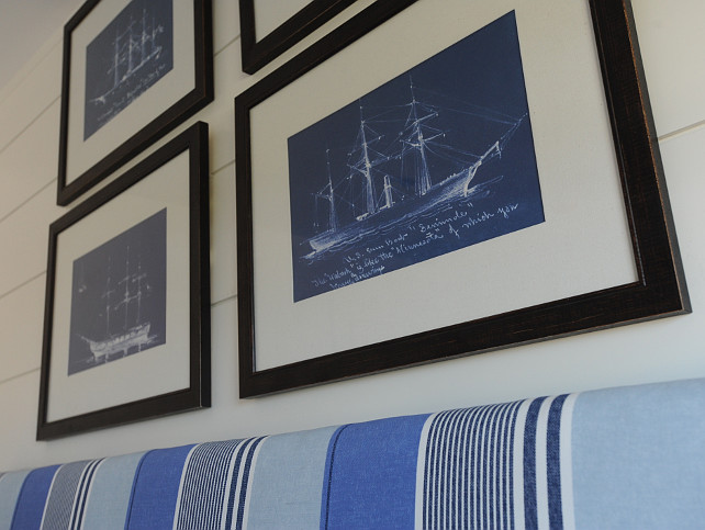 Coastal Bedroom. Coastal Bedroom Decor Ideas. Coastal Bedroom featuring framed sailboat blueprints over a blue striped headboard. #CoastalBedroom #SailboatBlueprints Nina Liddle Design.