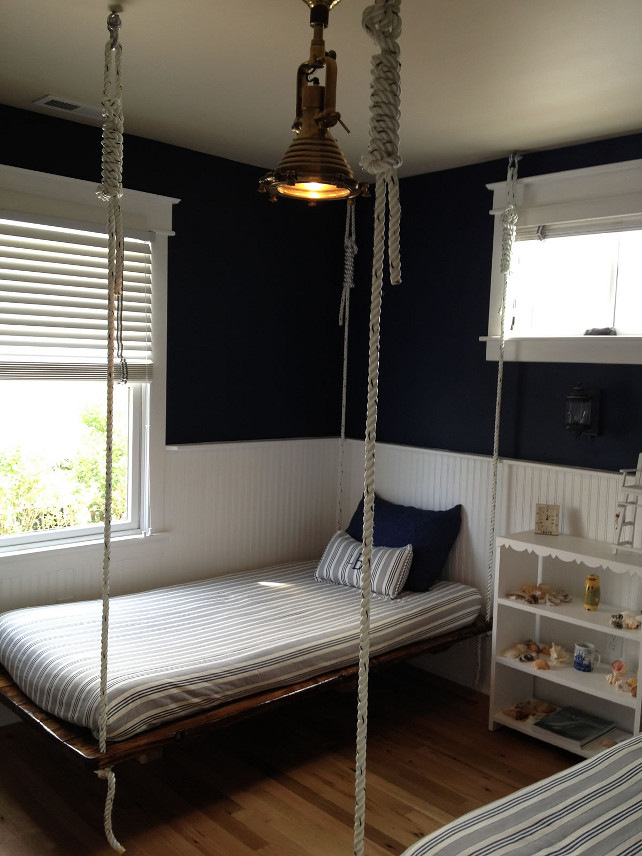 Coastal Bedroom. Coastal bedroom with split-shine plank beds hanging from dock line and a sharp navy and white color scheme. #Coastal #CoastalBedroom #PlankBed #SplitShine #Plank #Nautical #CoastalPalette