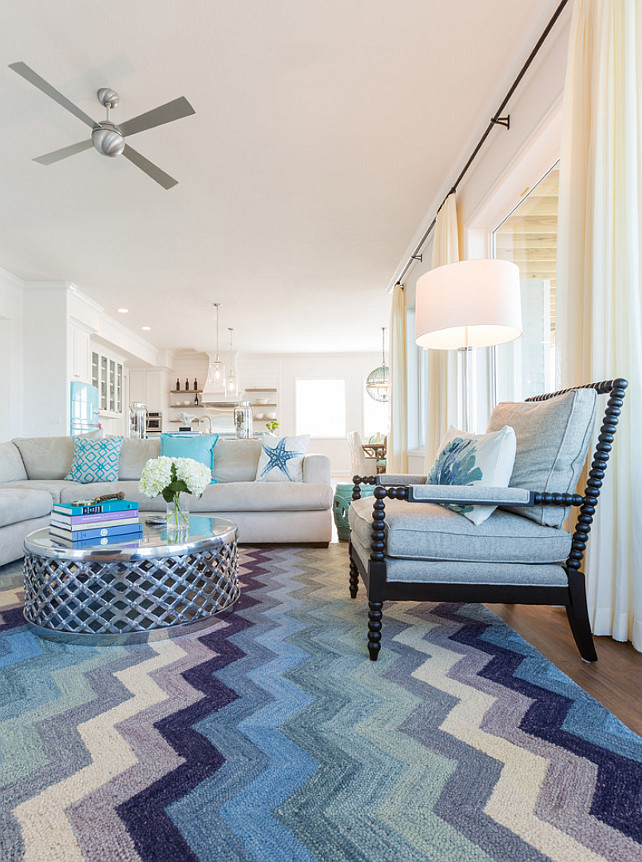 Coastal Living room with blue chevron rug, spindle chair and linen sectional. #Coastal #LivingRoom #Chevron #Rug #Sectional #Sofa #SpindleChair Laura U, Inc.