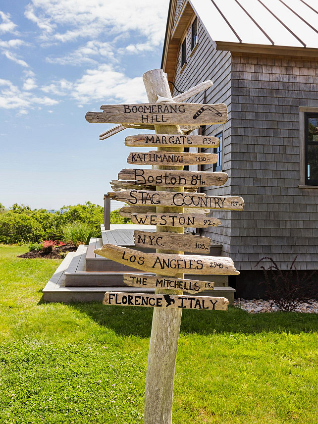 Coastal Signs. Coastal Sign Ideas. A signpost points the way to locations important to the family. #CoastalSigns HGTV.