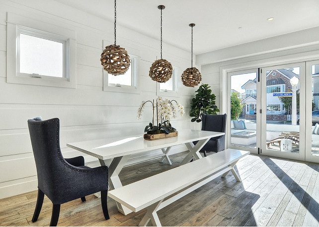 Cottage Dining Room. Cottage Dining Room white paneled walls. Dining Room Round Driftwood Pendants. Pendants are the "Driftwood Ball Pendant Light" by Shades of Light. #CottageDiningRoom #DiningRoom #Cottage #CoastalCottage #DiningRoomLighting