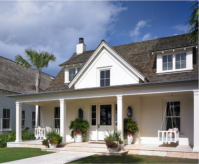 Cottage. Beach Cottage. Beach Cottage with a pair of white swing in the front porch. #Cottage #BeachCottage #Swing #WhiteSwing #Porch Cronk Duch Architecture.