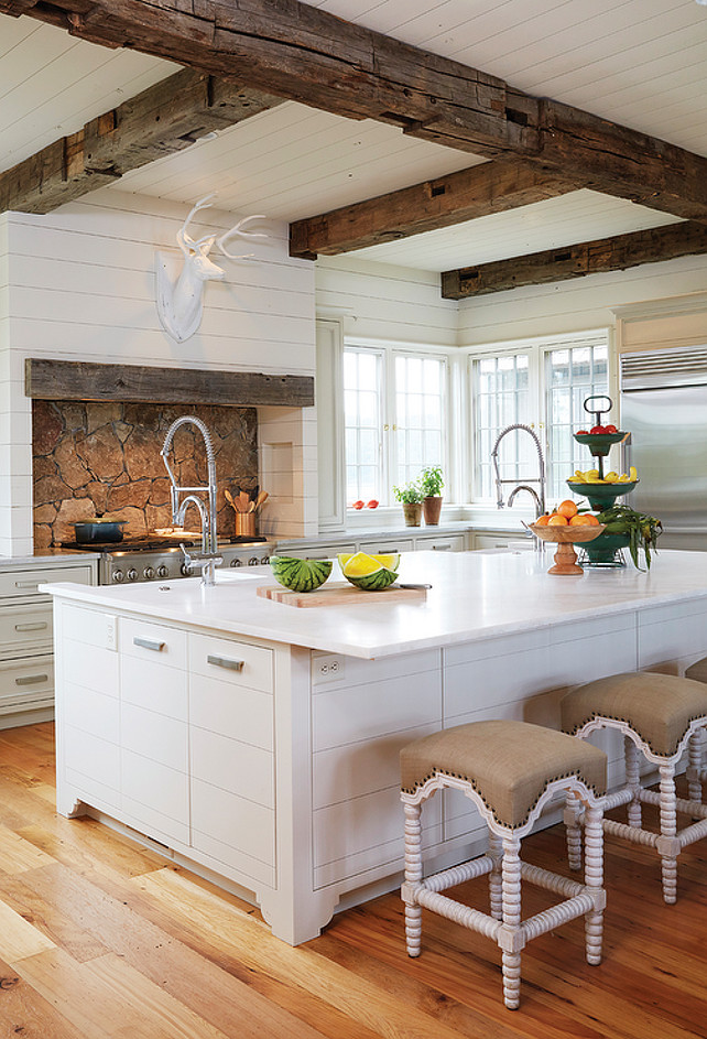 Country Kitchen with Wooden Beam Ceiling. Country kitchen boasts white plank ceiling dotted with rustic wood beams. #CountryKitchen #BeamCeiling Birmingham Home and Garden