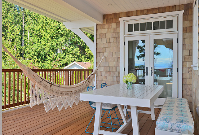 How to install a hammock in a patio: There is a post in the wall that is supporting a number of beams above. The hammock eyelet is screwed into that hidden post. Sunshine Coast Home Design.