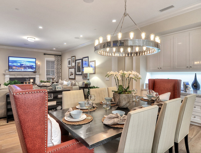 Dining Area. Transitional Dining Area. Dining Area Ideas. Above the table is a polished nickel circular chandelier, adding light and beauty to this dining area. #DiningArea #DiningRoom