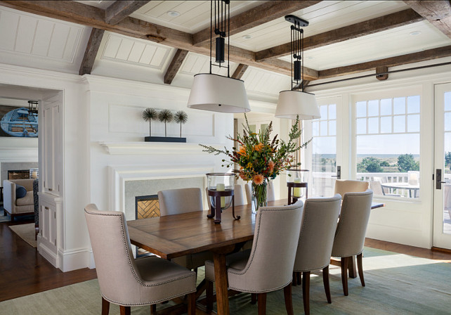 Dining Room. Coastal dining room with plenty of natural light and beautiful furnishings. I always like the idea of opting for two pendant lighting above a dining table instead of a single chandelier. This brings a more casual feel to this elegant dining room. Paint Color is 50% China White, 50% Linen White by Benjamin Moore. #DiningRoom #DiningRoomIdeas