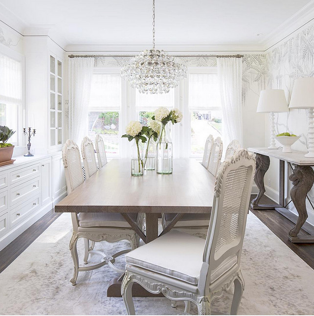 Dining Room. White Dining Room. White dining room with cane chairs and white built-in cabinets. #DiningRoom Martha O'Hara Interiors.