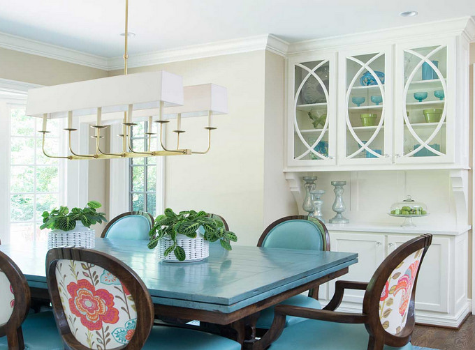 Dining room with turquoise accents. Profile Cabinet.