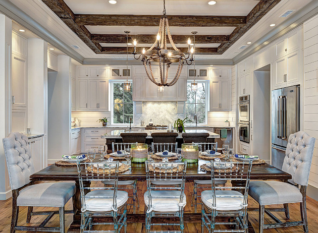 Dining room. Dining Room Beamed ceiling, Dining Room gray tufted chair, Griffin Rope Chandelier, Rectangular dining table, Rope chandelier, Rustic wood ceiling beams. Ink Architecture.