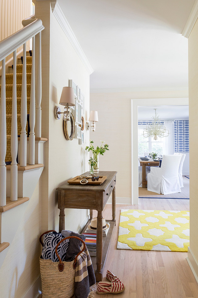 Entry foyer. Entry foyer design. Neutral entry foyer. Entry foyer view. Dining room in the distance. Foyer grasscloth covered walls, bleached oak floors. #Foyer #Entry #EntryFoyer Chango & Co.