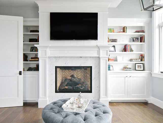 Fireplace. Fireplace Ideas. Marble surround fireplace. Marble surround fireplace Ideas. Marble surround fireplace with built-ins on both sides. #Marblesurroundfireplace #Fireplace Brandon Architects, Inc.