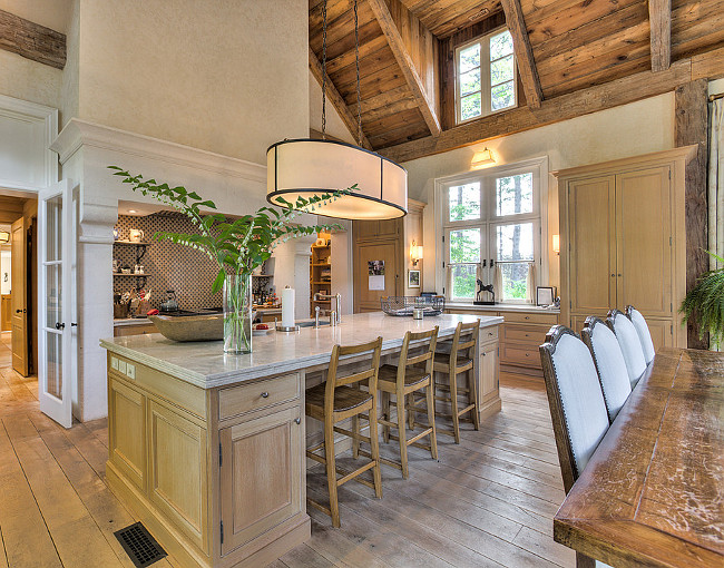 French Country Kitchen Island. The kitchen is all about charm and family time. I love the large island and the whitewashed oak cabinets. French Country Kitchen Island Ideas. French Country Kitchen Island. French Country Kitchen Island with Limestone Countertop. #FrenchCountry #KitchenIsland
