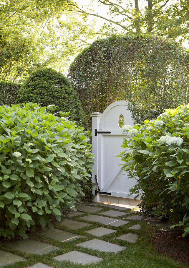 Garden Gate. White garden gate surrounded by hedges and mature landscaping. #Gate #Garden #Landscaping Emily Gilbert Photography.