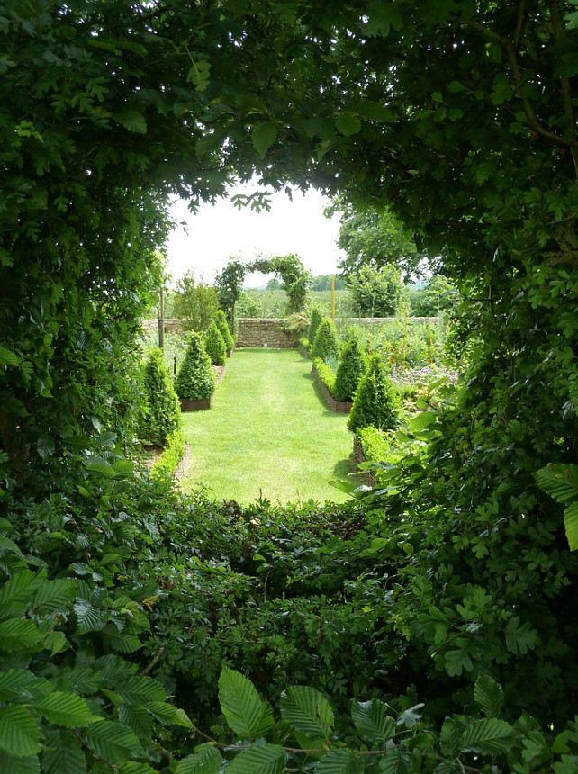 Garden. French Garden Design Ideas. #FrenchGarden The vegetable garden can be seen from the hydrangea garden through an oeil-de-boeuf, or round window, trimmed into the hedge. Philippe DUBREUIL Jardiniste.