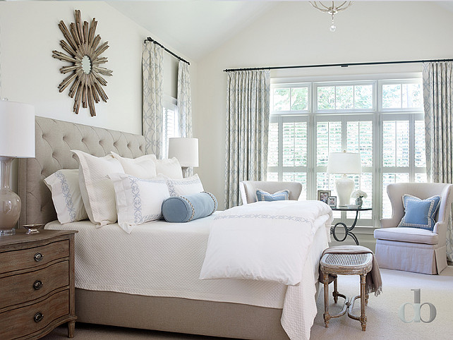 Gray Bedroom. Gray Bedroom with Blue Accents. Gray and blue bedroom features a wood sunburst mirror over a gray linen tufted bed. #GrayBedroom #BlueBedroom Jessica Bradley Interiors