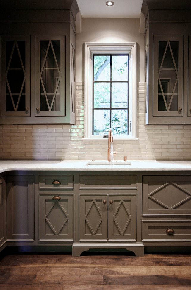 Gray Kitchen Cabinet with white subway tiling backsplah and La Perla Venata quartzite kitchen countertop. CR Home Design K&B