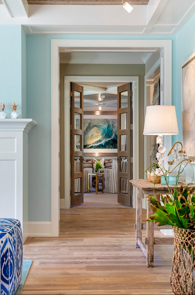 Hallway decorating ideas. Hallway coastal decor. Hallway with blue walls, bleached plank floors and coastal decor. #hallway Great Neighborhood Homes.