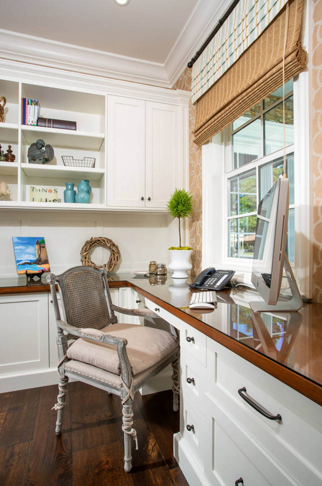 Home Office Workstation with built-in desk and cabinets. Window shades. #HomeOffice #Workstation Legacy Custom Homes, Inc.