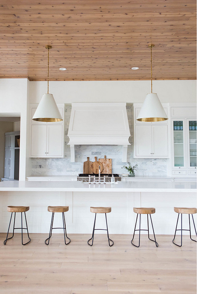 How to Design a Transitional White Kitchen. To design a transitional white kitchen you have to make sure to warm the space up with wood and natural elements. #Kitchen #WhiteKitchen