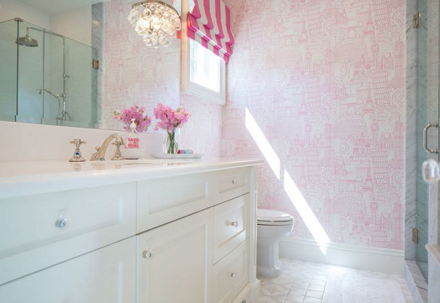 Kids bathroom with wallpaper. This white and pink kid's bathroom features pink Parisian wallpaper and Robert Abbey Bling Sconces. #Kids #Bathroom #Wallpaper Kelly Nutt Design.