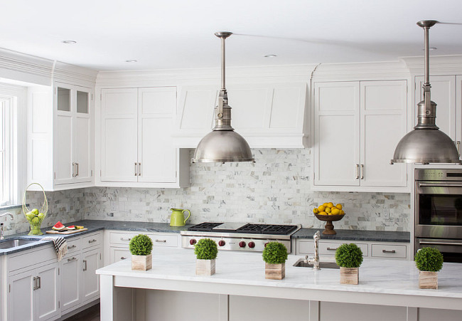 Kitchen Countertop combination. Kitchen perimeter and island countertop combination. Perimeter is Classic Soapstone. Island is Calacatta Gold Marble in Honed Finish. Connecticut Stone.