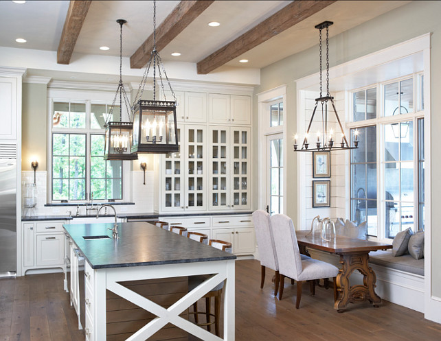 Kitchen Ideas. Kitchen and Nook Ideas. Beautiful kitchen with white cabinets and nook. The wall color is BM HC-95 "Sag Harbor" the cabinet and trim color is SW 7531 "Canvas Tan". #Kitchen #KitchenNook #Nook #KitchenIdeas