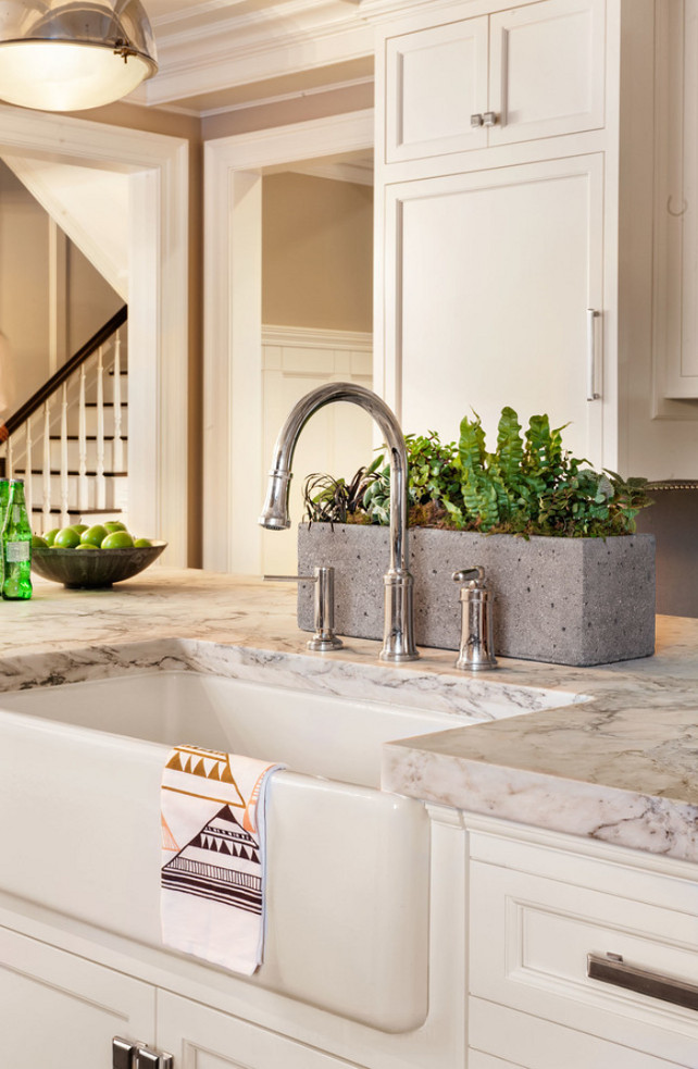 Kitchen Island Sink. Apron Sink. Island countertop is White Arabesque Honed Marble. Kitchen Island Sink Ideas. #KitchenIslandSink #KitchenIsland #Sink Garrison Hullinger Interior Design Inc. Faucet is the "Quincy Pull Down Faucet by Kallista".