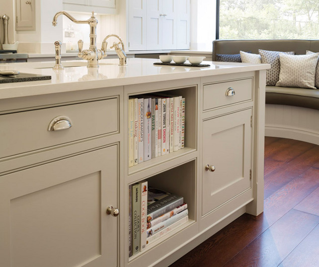 Kitchen Island. Kitchen island cookbook shelf sits at front of island as well as built-in curved banquette with beadboard trim. #KitchenIsland Tom Howley