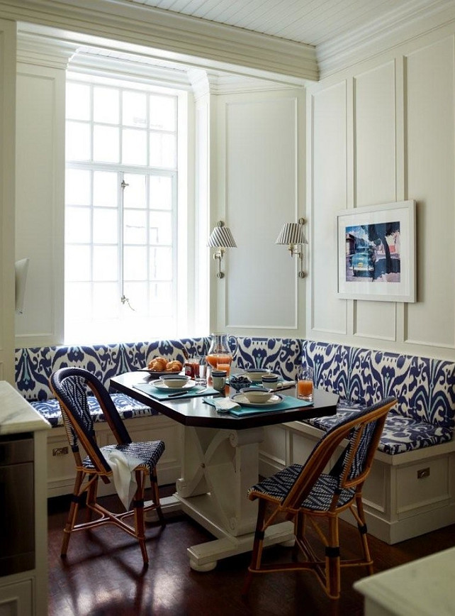 Kitchen Nook. The upholstery of the banquette seating in this kitchen adds a splash of color to the white woodwork. #BreakfastNook #banquette  Studio 511