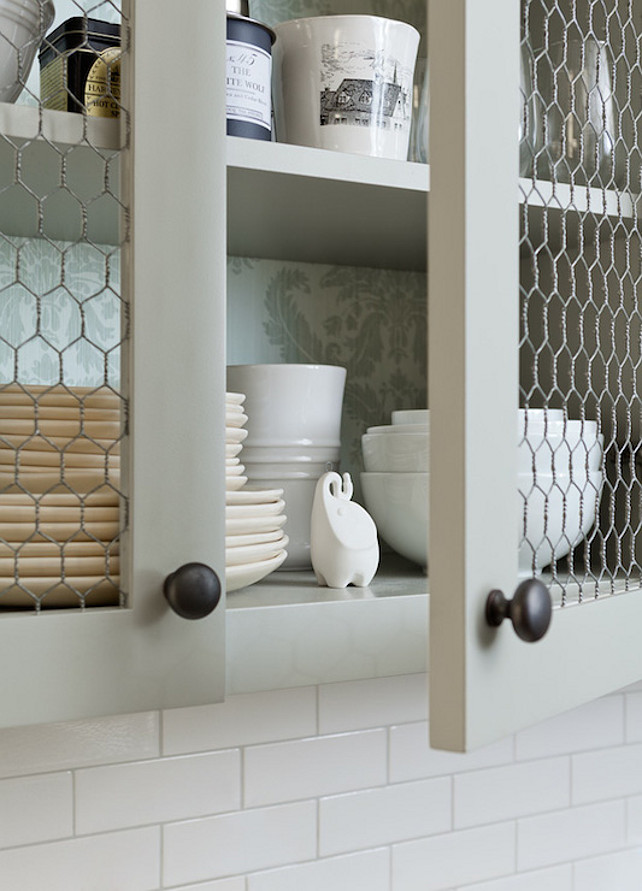 Top Kitchen with Chicken Wire Cabinet Doors Pin. Kitchen with Chicken Wire Cabinet Doors. This kitchen boasts upper cabinets, with backs of shelves lined with gray damask wallpaper, accented with chicken wire doors. Jenny Wolf Interiors.