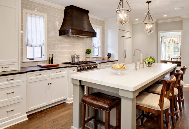 Kitchen. Kitchen remodel featuring a custom hood, Virginia Mist perimeter tops, Danby Marble island top, custom white cabinetry, and subway tile. #Kitchen Bartelt. The Remodeling Resource