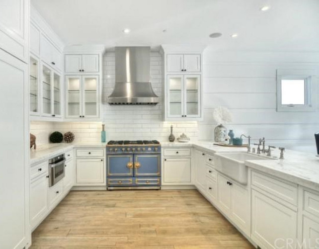 Kitchen. White Kitchen with blue range. White Kitchen cabinets. White Kitchen with wide plank hardwood floors. #WhiteKitchen #Kitchen