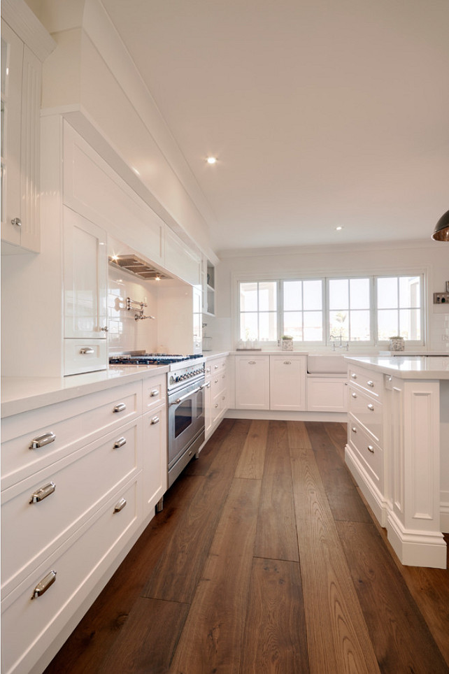 Kitchen. Kitchen with white cabinets and Wide hardwood plank flooring. #Kitchen #WhiteKitchen #WidehardwoodplankFlooring