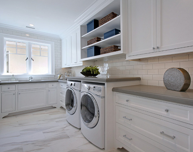 Laundry Room. Laundry room with white shaker cabinets, marble tile floors, grey quartz countertop, shelving and subway tile backsplash with grey grout. #Laundryroom