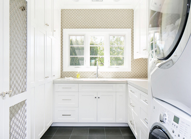 Laundry room. Neutral Laundry room with bluestone floor tiles. Laundry room with white cabinets. Laundry room with wallpaper. Floor to ceiling Laundry room cabinet. #Laundryroom Brooke Wagner Design.
